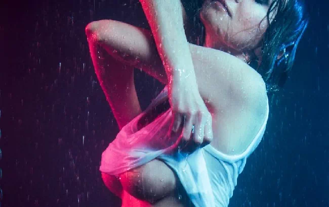 Woman taking her shirt off