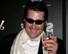 Phil Hellmuth sips bubbly on the red carpet